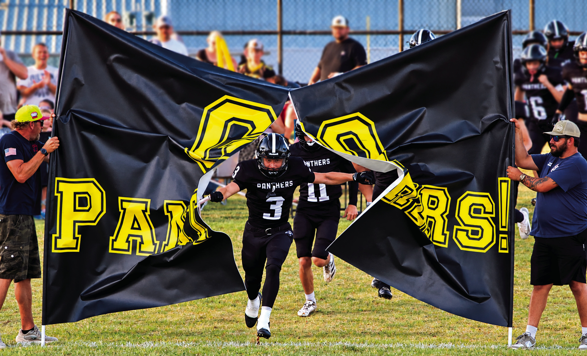 Panther senior Mark Mascho breaks through the Oilton banner as the Panthers run onto the field for the first time in 34 years. See inside for more… Photo by Allie Prater.