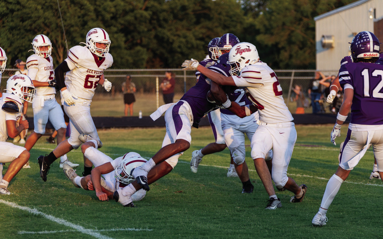 Colter McArthur, #20, stops a Hominy running back. Photo by John Burns