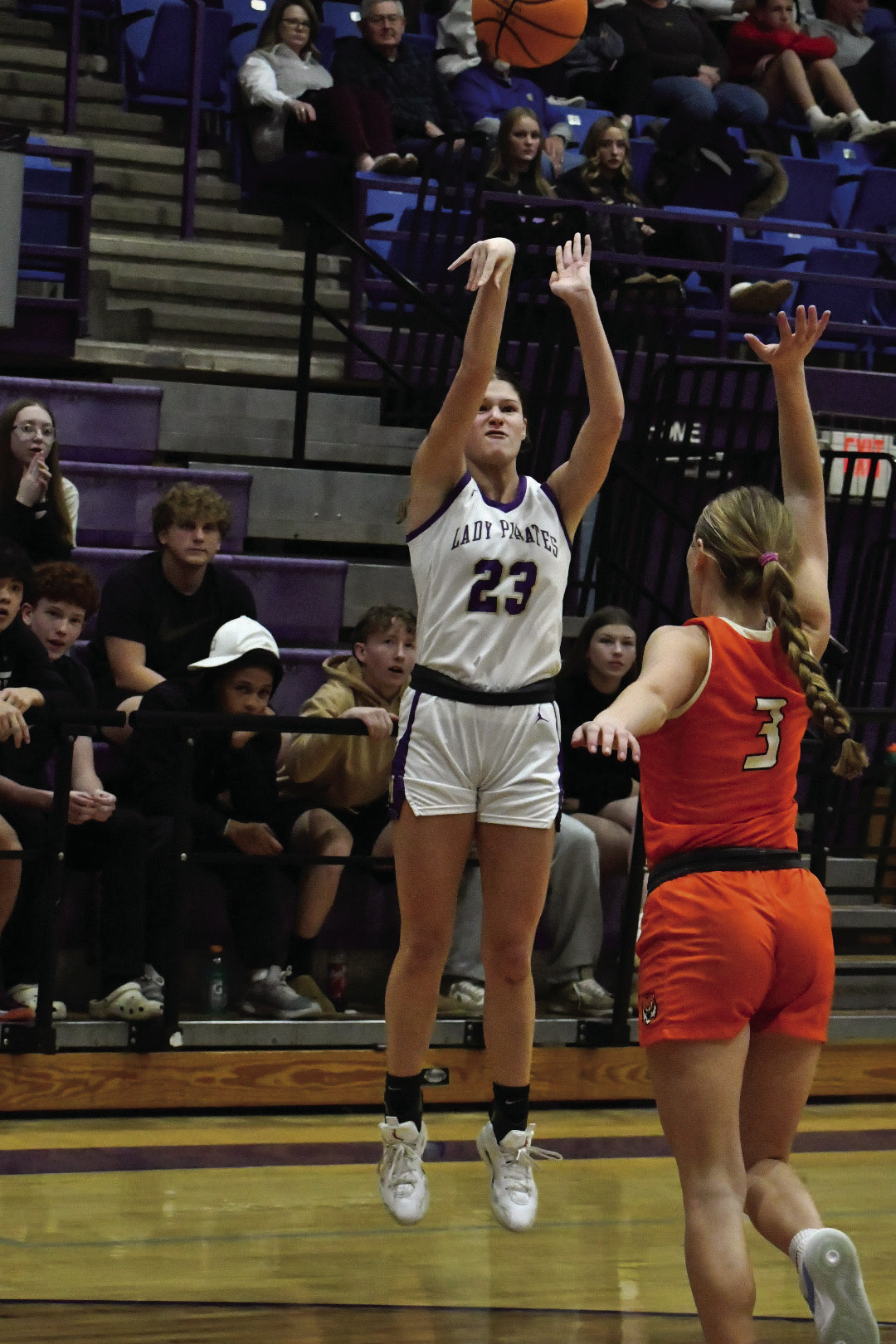 Addison Pehrson fires off a three against Cushing’s Cora Eyler in the Lady Pirate win over the Lady Tigers. Pehrson had 29 points. Photo by Sarah Townes