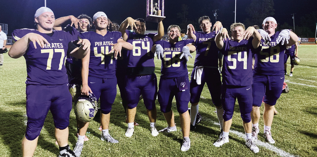 Giddy Mannford Pirates flash the “M” as they raise the coveted “Battle of the Boats” trophy in Bristow.