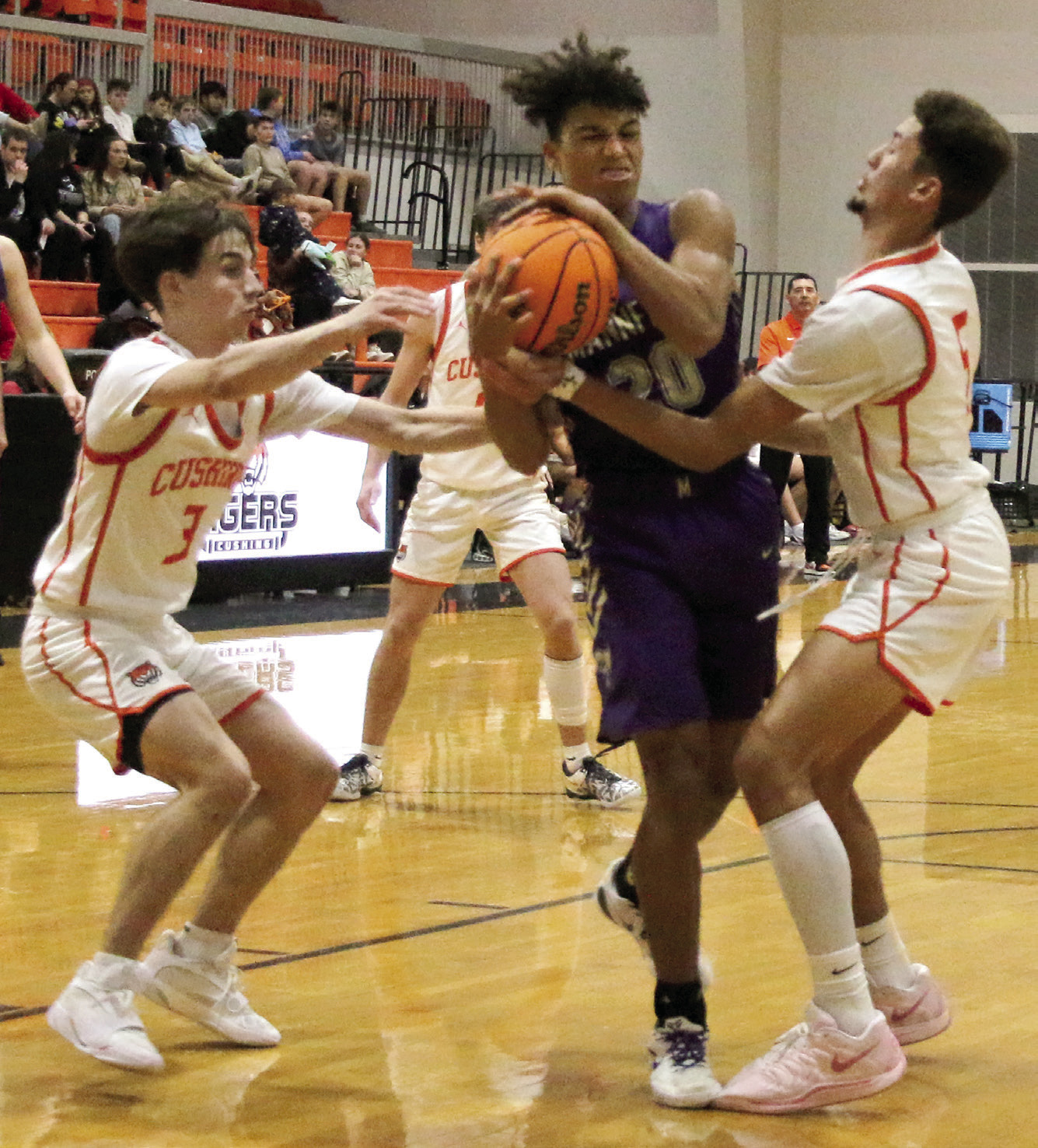 Landon Owens fights to keep possession of the ball. Photo by Allie Prater