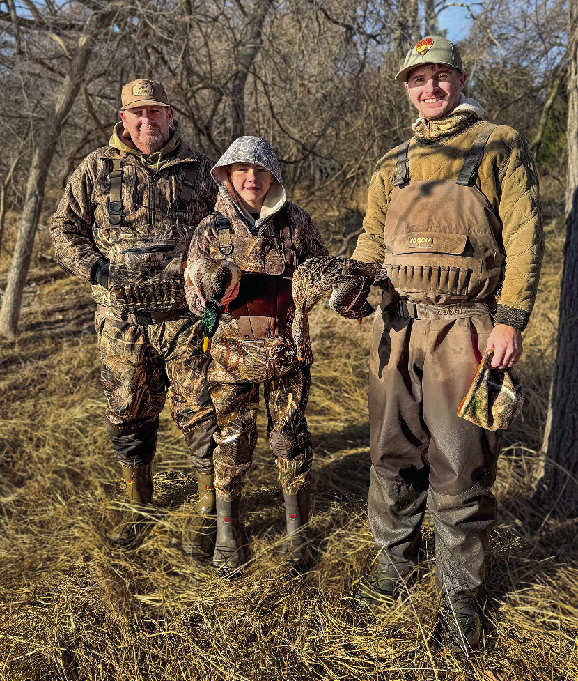 Ryatt, 12, and his guardian, left, went on a Wildlife Department youth waterfowl hunt with ODWC wildlife biologist Paxton Smith as their guide. Photo by Heather Del Moral ODWC