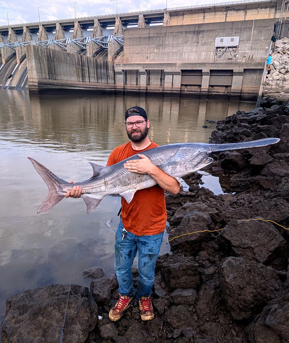 From the Oklahoma Department of Wildlife Conservation files: Micah B. shows off a massive paddlefish he caught last week just below Keystone Dam.