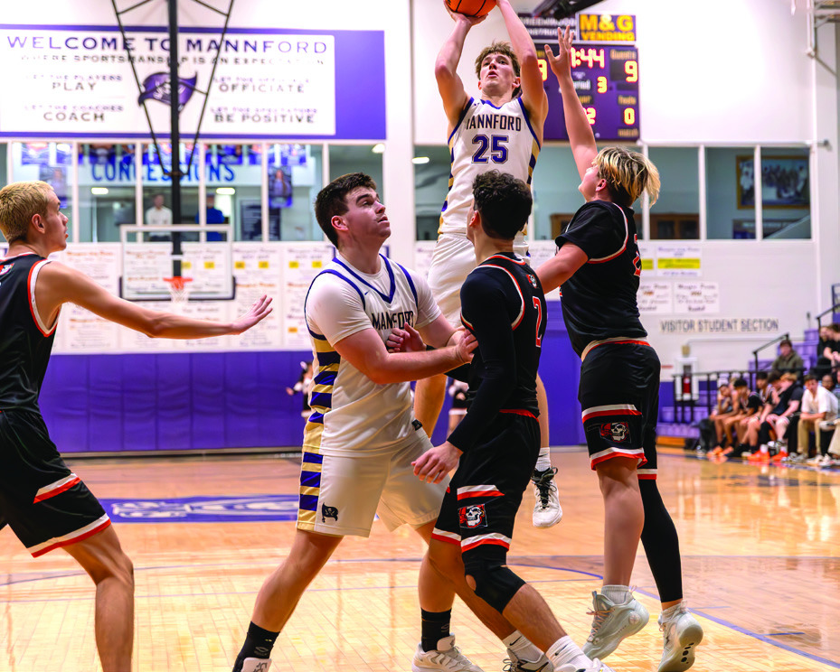 Max Moore takes the shot as Pirate Cooper Ausbern blocks out defenders.