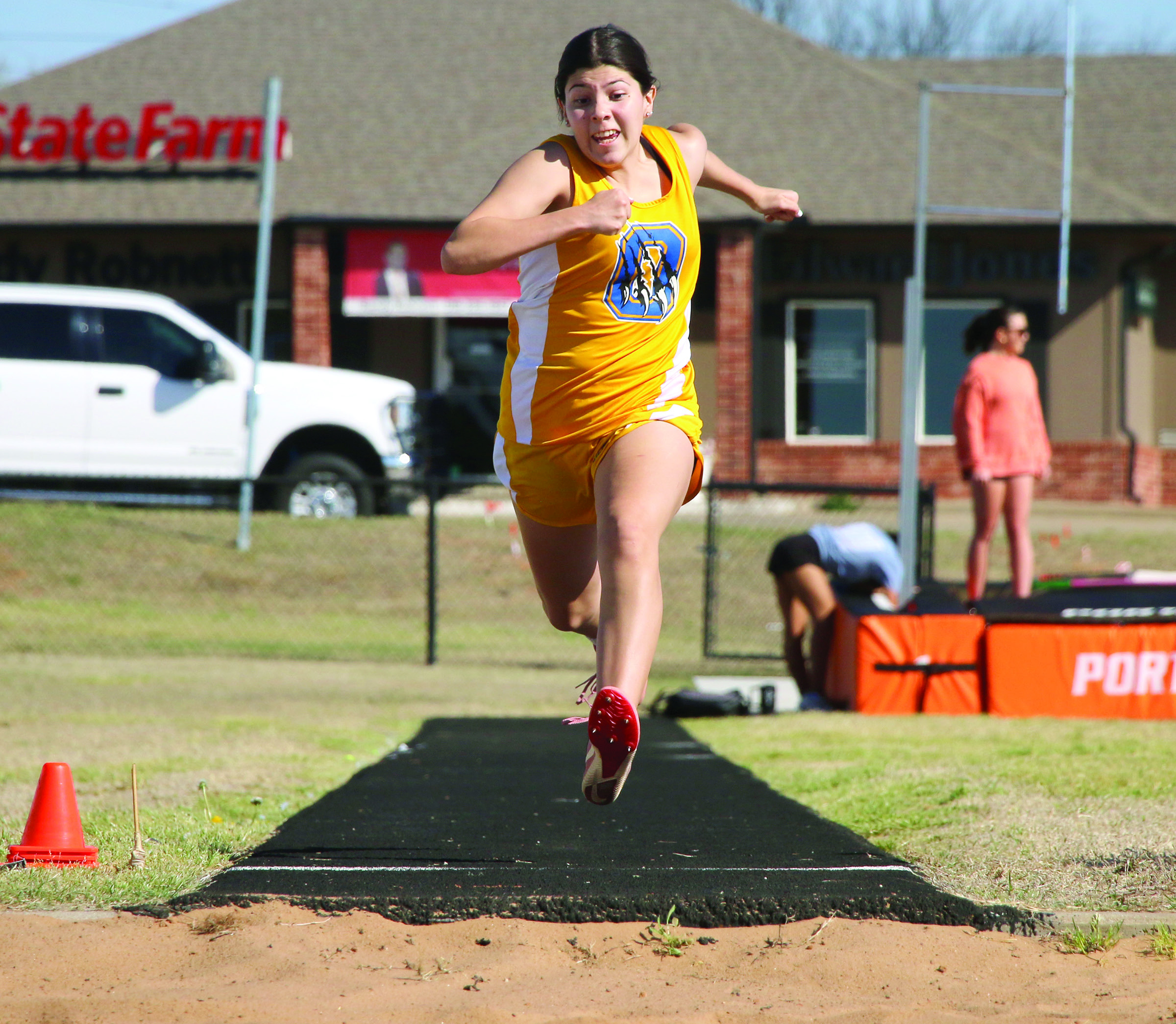 Oilton’s Arely Perez gathers momentum on her approach down the long jump runway Thursday, March 26 at the Cushing Crossroads Relay track meet at O’Dell Field. Perez placed 16th with a 10-8.8. Photo by Allie Prater