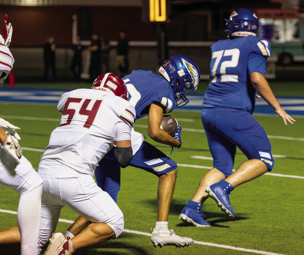 Senior Machael Harjo stops runner for a short gain.