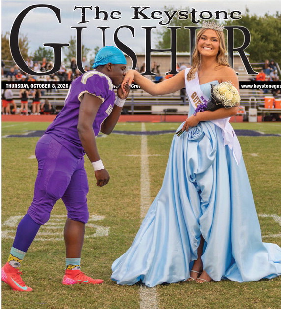 Mannford Pirate Homecoming King J. J. Hindsman kisses the hand of Homecoming Queen, her majesty, Adley Elliott during homecoming festivities at Pirate Field last Friday. Photo by John Burns