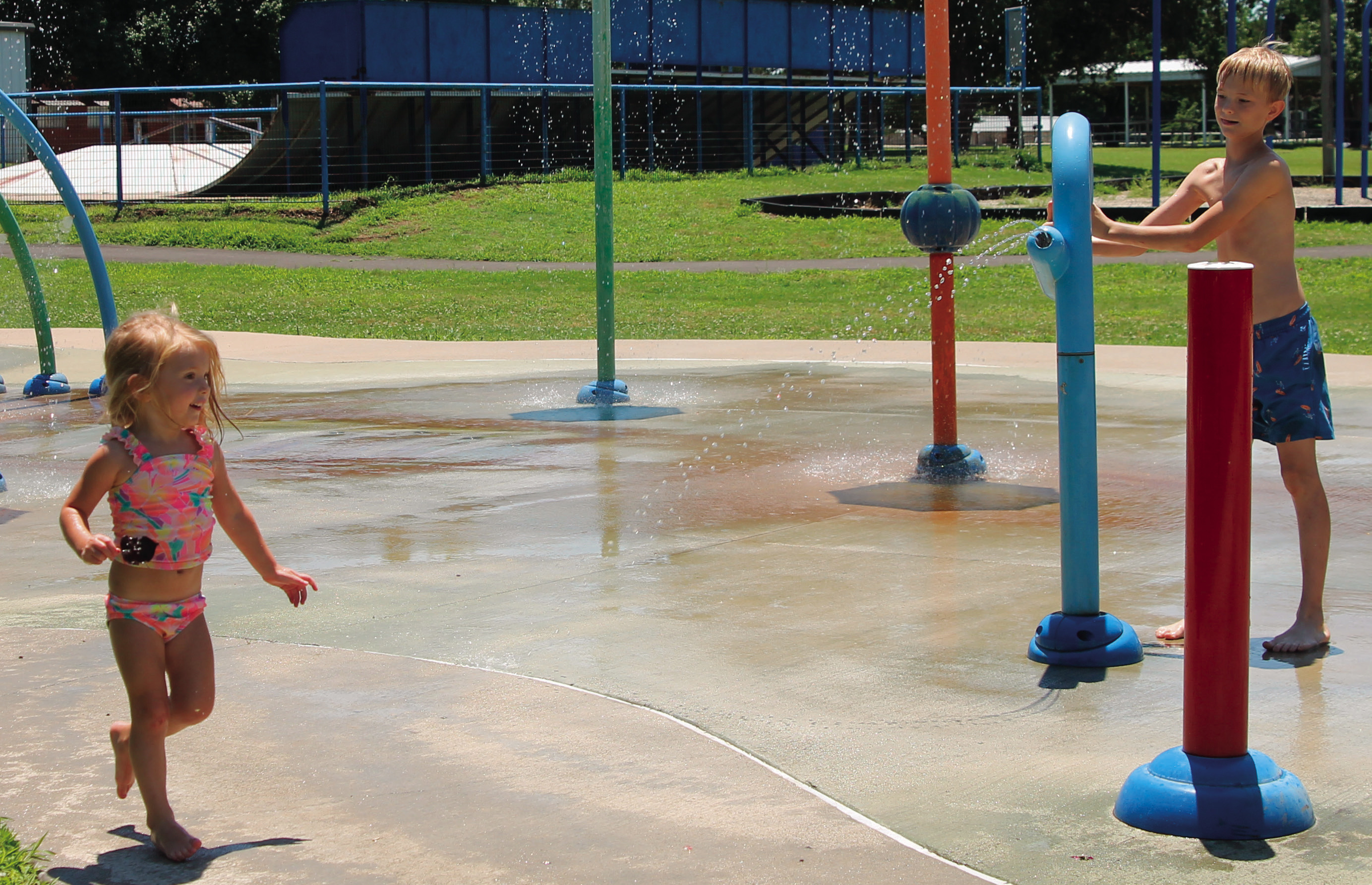 Hally (2) and Liam (9) Helms had a splash of fun at Whitlock Park in Drumright. Photo by Caleson Coon.