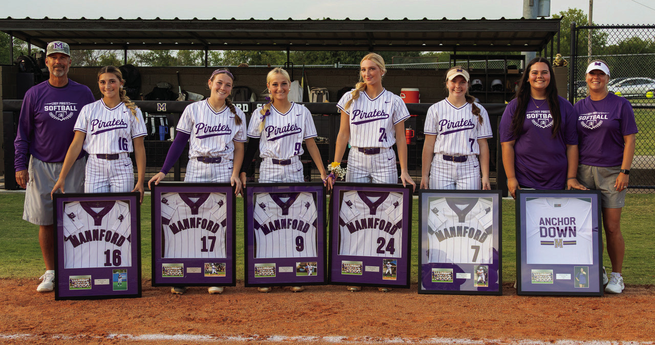 Mannford Lady Pirate seniors celebrate Senior Night as district champions. Seniors are #16 Ava Burton, #17 Cambri Casey, #9 Brooke Kyser, #24 Lexi Lovekamp and #7 Carlee Maxville, along with manager Avery Black. The Lady Pirates are coached by head coach Russell Wood and assistant coach Lindsay Gilbert. Photo by John Burns