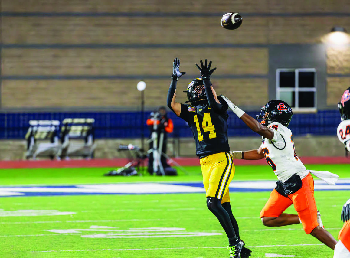 Paxton Salazar keeps a Sand Springs scoring drive alive with a catch under pressure. Photo by John Burns