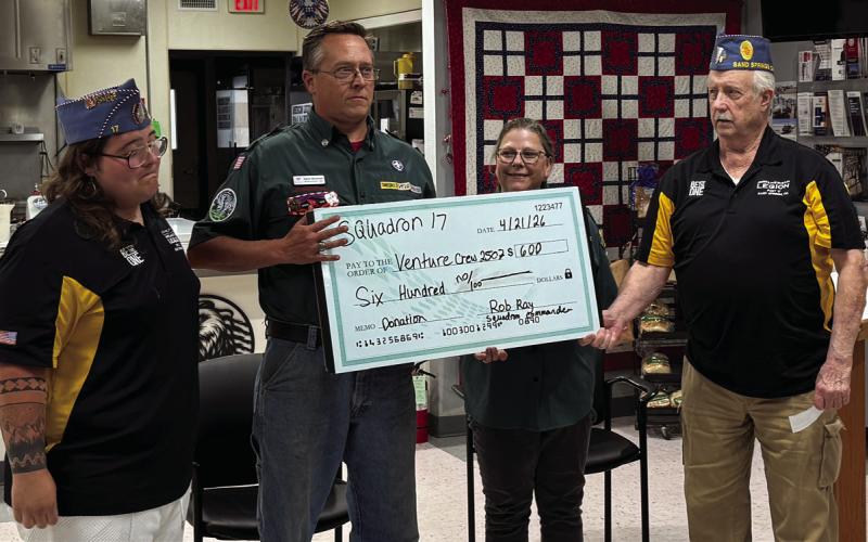 Venture Crew #2507 is presented with $600 from Sand Springs Sons of the American Legion (SAL) at the Veterans Center on April 21. Pictured from left are SAL Treasurer Andrew Miller, Venture Crew member Aaron Goodman and Brandy Goodman, and SAL Squadron Commander Rob Ray.