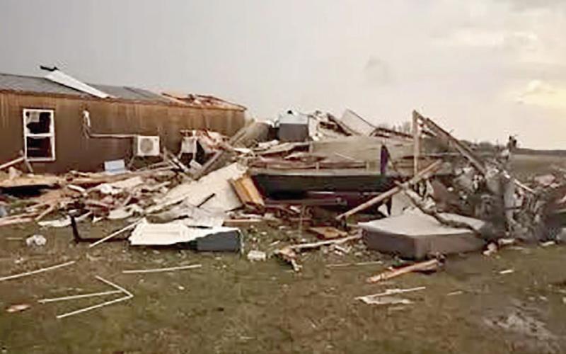 A mobile home lies destroyed and scattered across a yard after a tornado struck in Creek County.