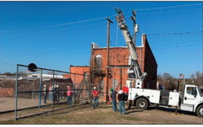 Individuals enrolled in the Central Tech lineman program used a pole truck to auger the holes for the project’s light poles.