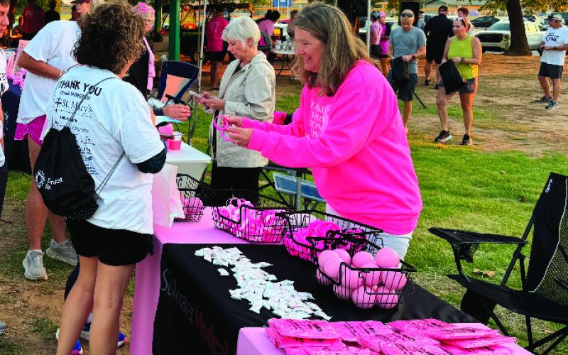 Pictured at the Enid breast cancer awareness event, Shyla Eggers promotes Stillwater Medical Center. After years of helping share patient stories, Eggers recently found herself navigating her own health journey with sleep apnea.