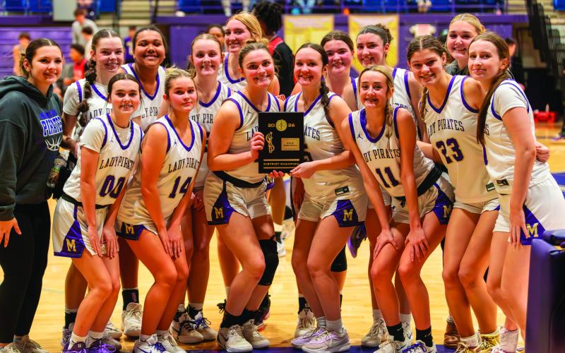The Mannford Lady Pirates are district champs after their 65-0 shutout of the Central Tulsa Lady Braves in front of a home-town crowd. The ladies, coached by Nathan Reed, are 15-8 on the season. Photo by John Burns
