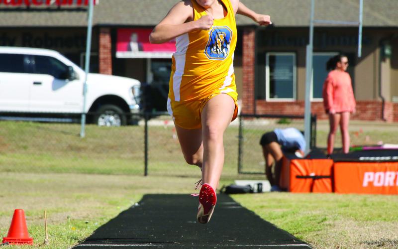 Oilton’s Arely Perez gathers momentum on her approach down the long jump runway Thursday, March 26 at the Cushing Crossroads Relay track meet at O’Dell Field. Perez placed 16th with a 10-8.8. Photo by Allie Prater